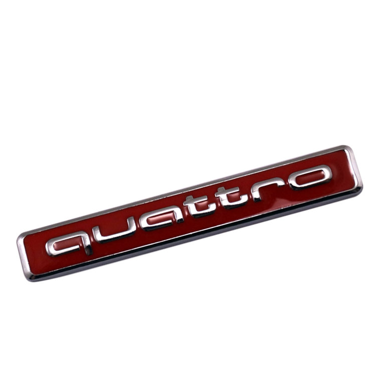 Металлическая эмблема Audi quattro 65*9  мм красный