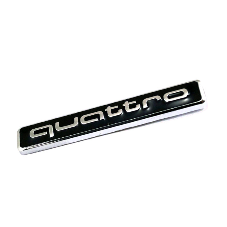 Металлическая эмблема Audi quattro 65*9  мм черный