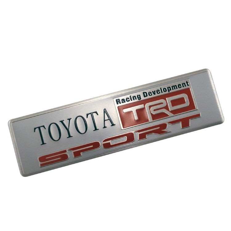 Шильдик Toyota TRD 120*26 мм серебро/красный